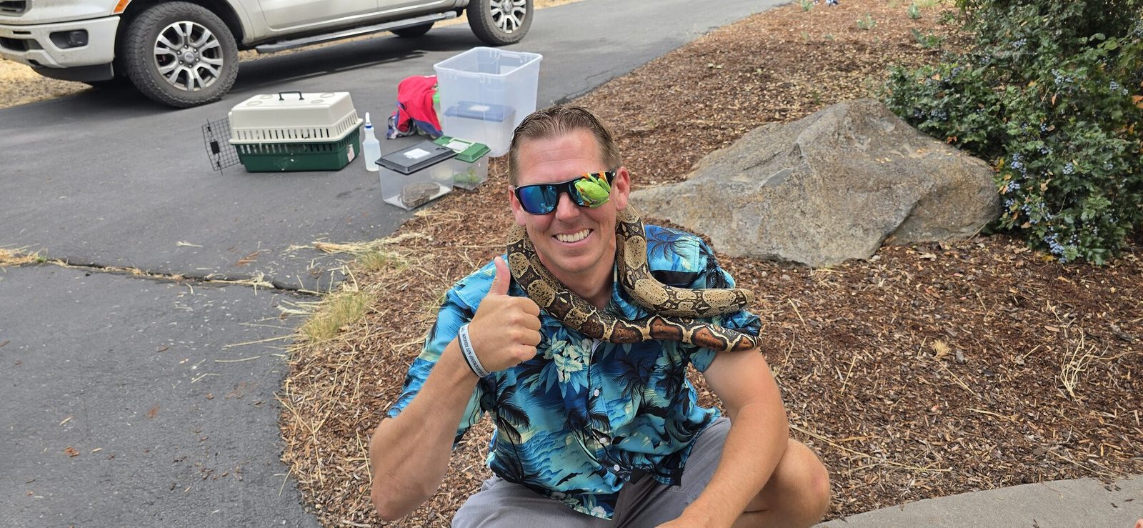 James McNamara of Hands On Critters with his boa constrictor in Klamath Falls