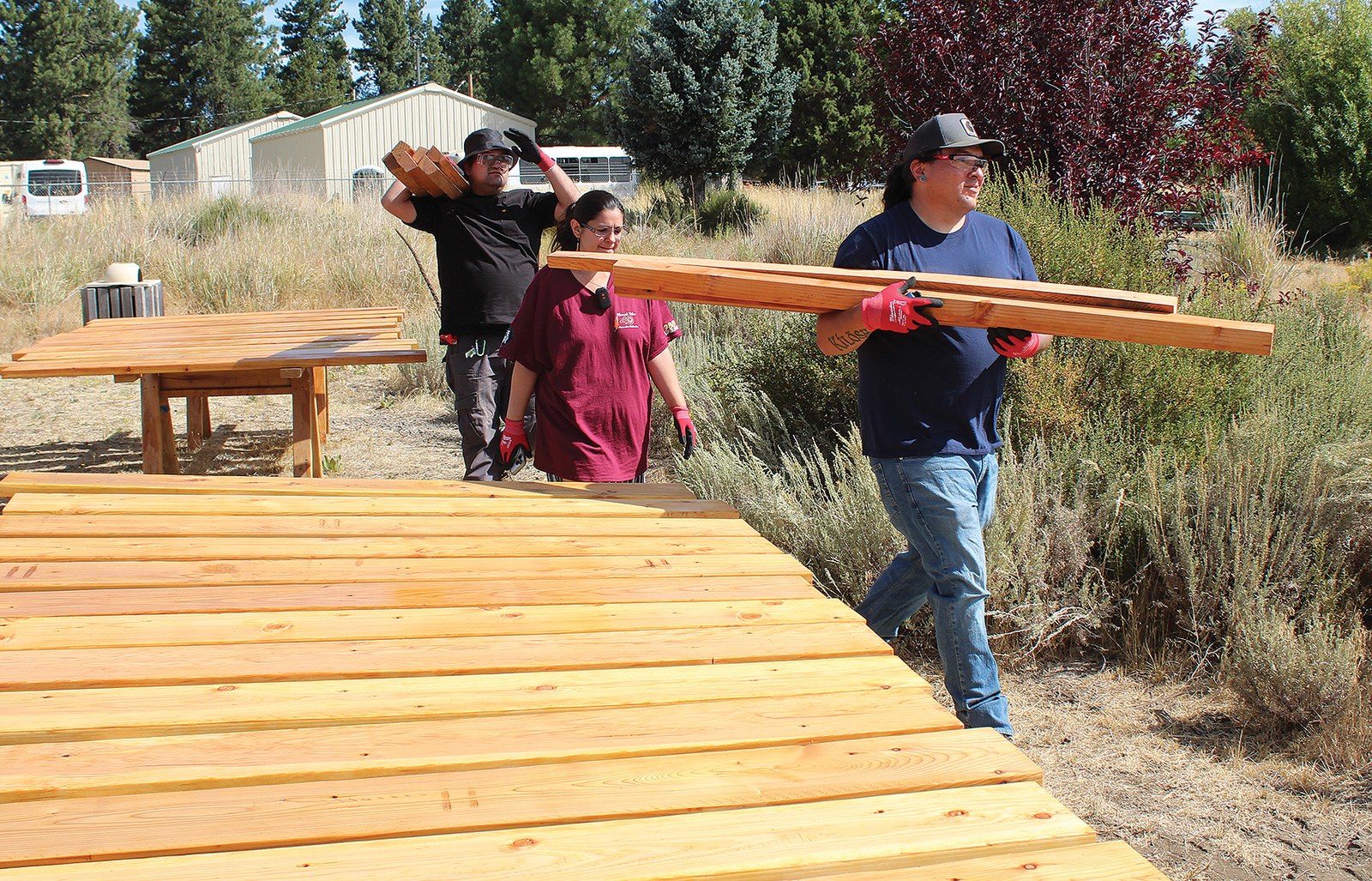 Klamath Tribes members prepare planks for picnic tables and park benches as part of their TERO training in partnership with the KCC Apprenticeship Center.
