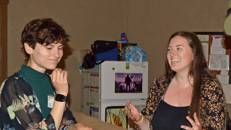 Outgoing director Natalie, (left), and Education Manager Mikaela, (right), smile as they recount some of their times together over the last several years.