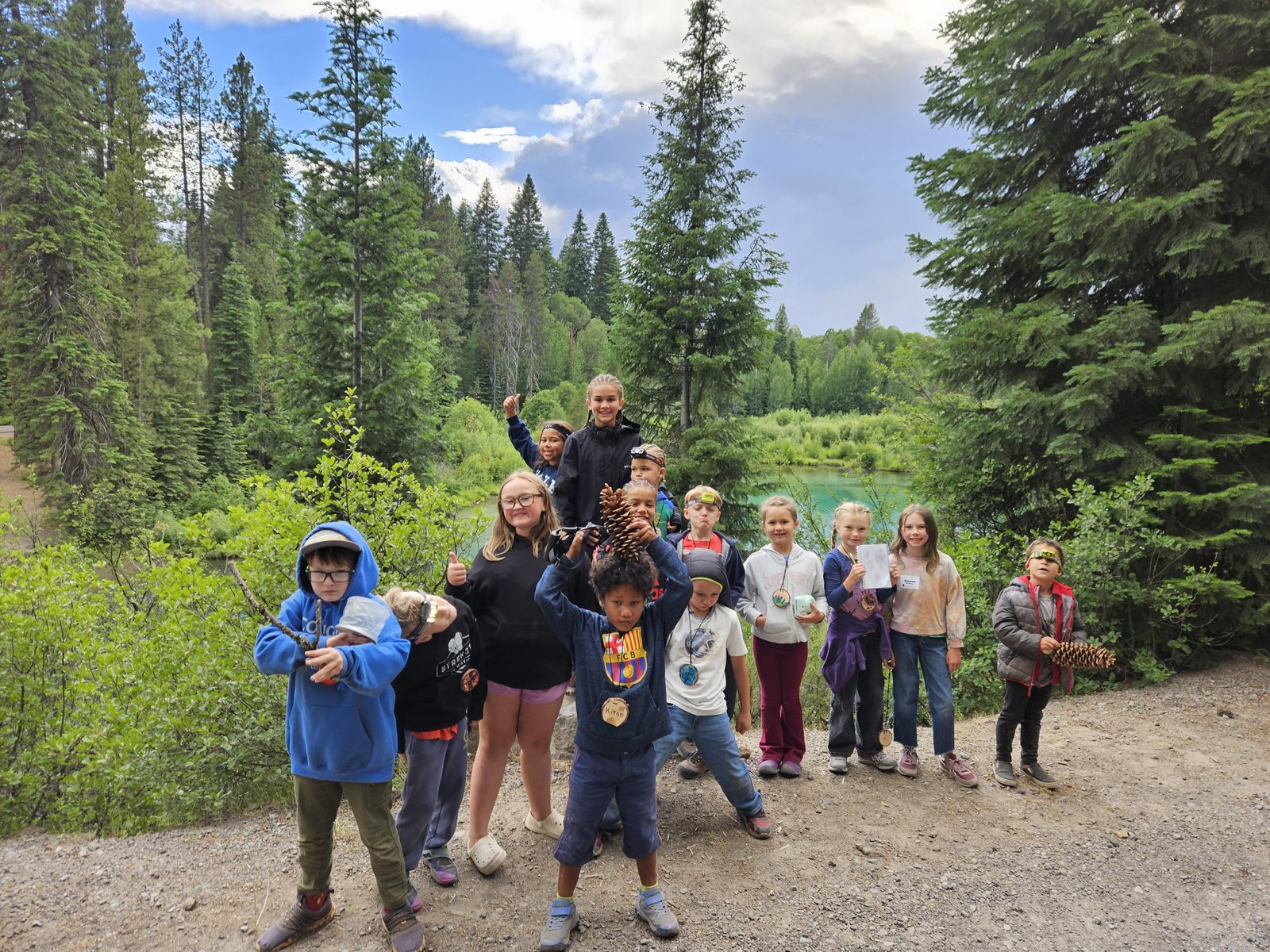Campers pose above the Wood River during an evening walk