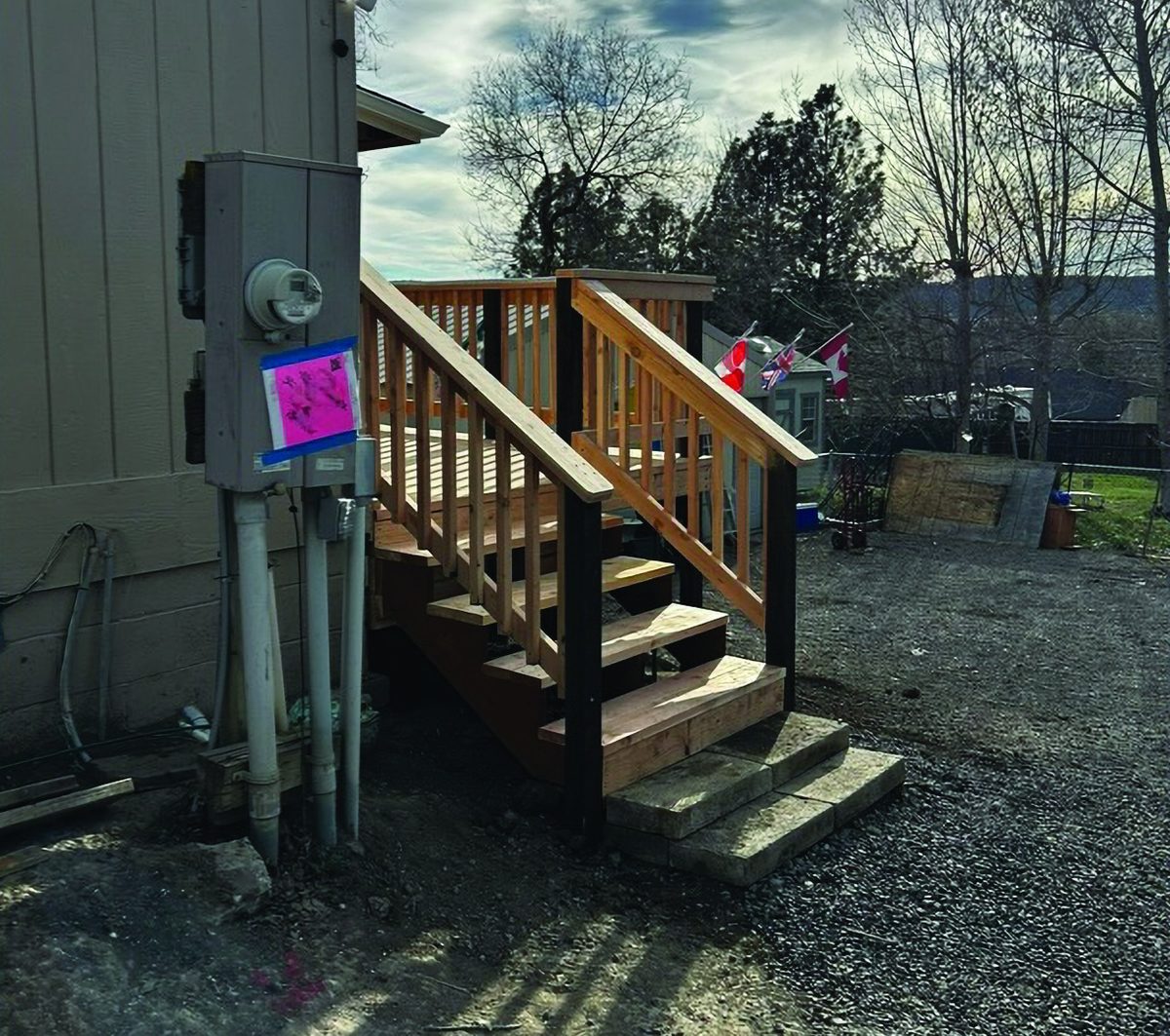 New wooden front steps and railing built by KB Premier Construction