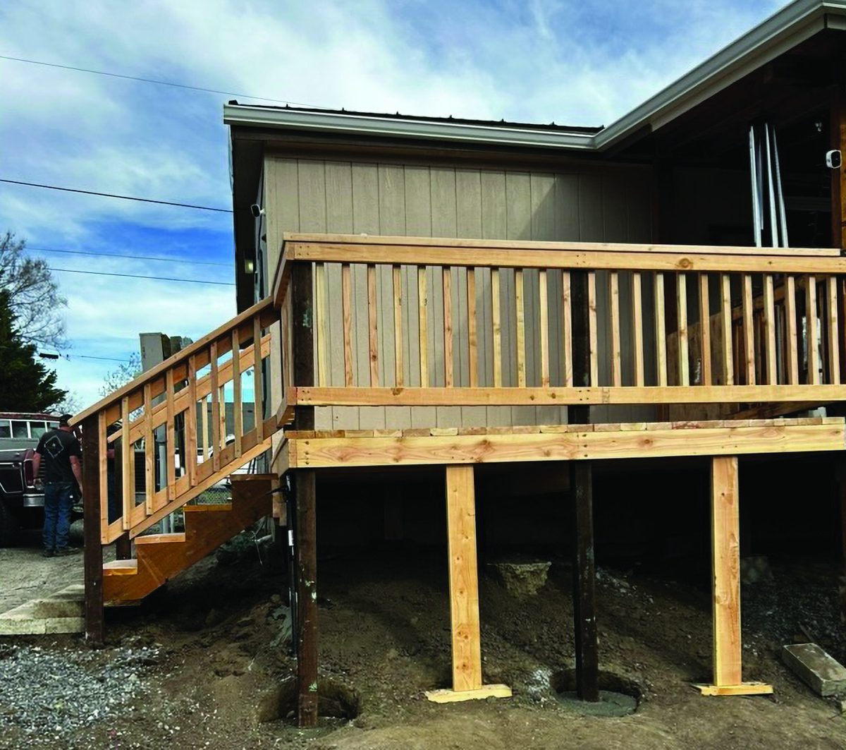 Raised side deck with wooden railing built by KB Premier Construction