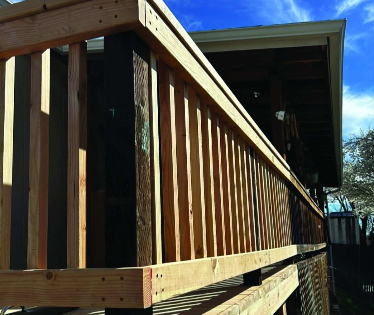 Close view of new deck railing and posts built by KB Premier Construction