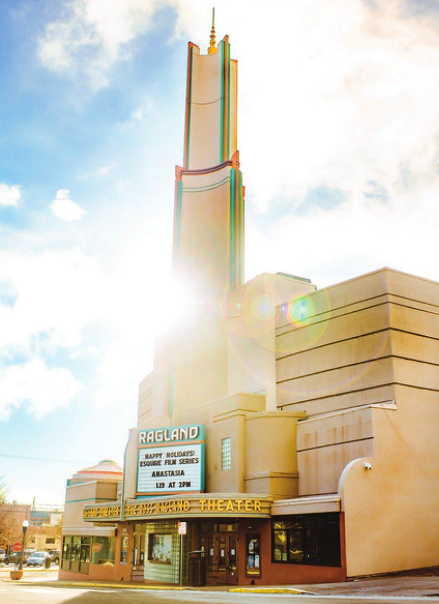 The Ross Ragland Theater's art deco tower and lit marquee on a sunny day in downtown Klamath Falls