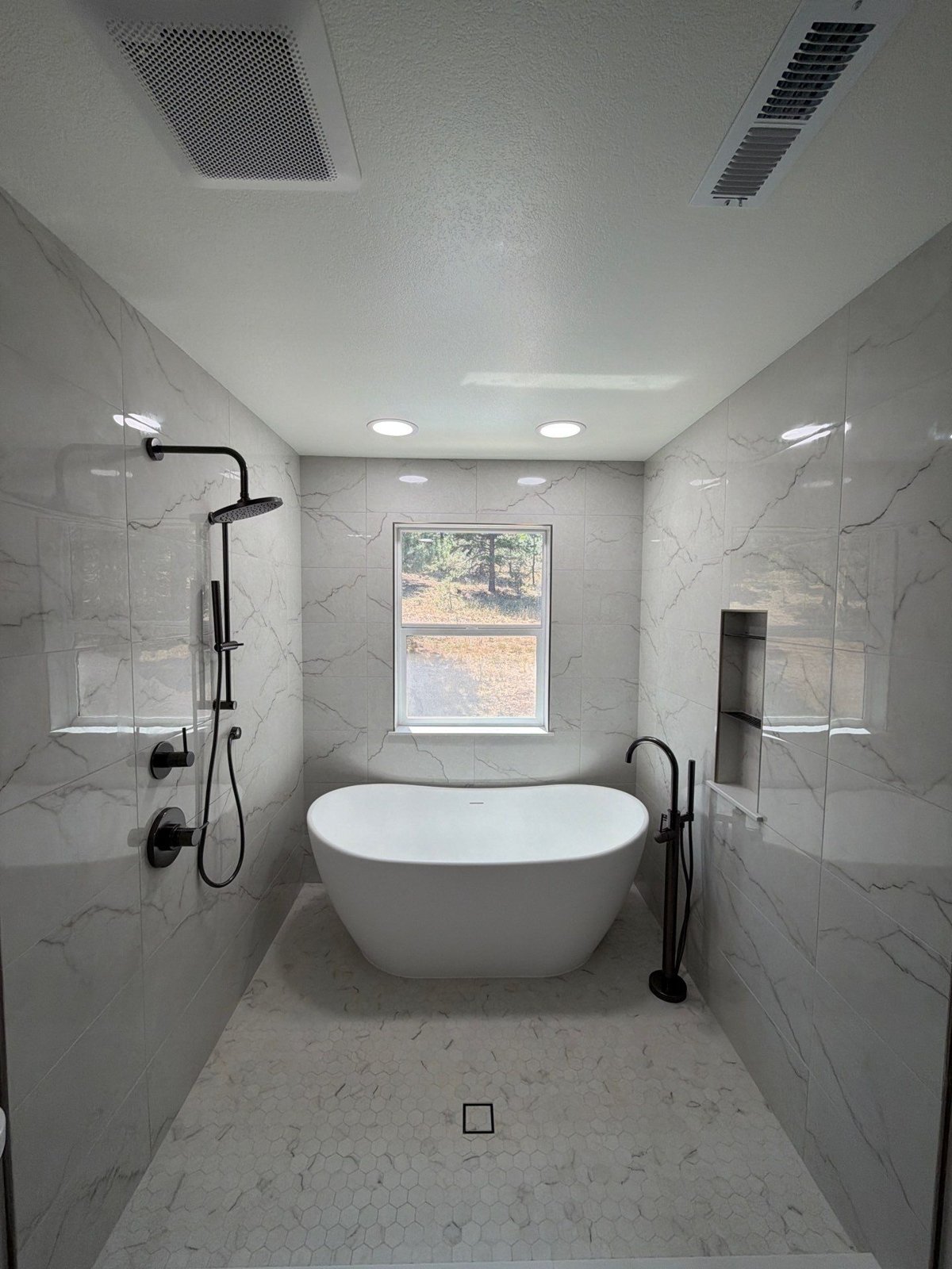Bathroom remodel with a freestanding soaking tub and walk-in shower