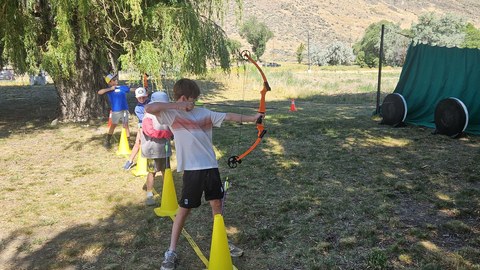 KOSS campers learning archery